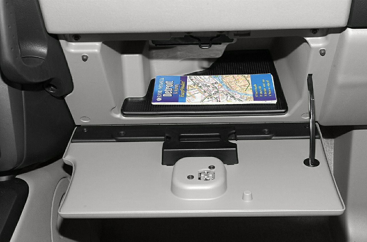 Open glove compartment with map holder and latch mechanism