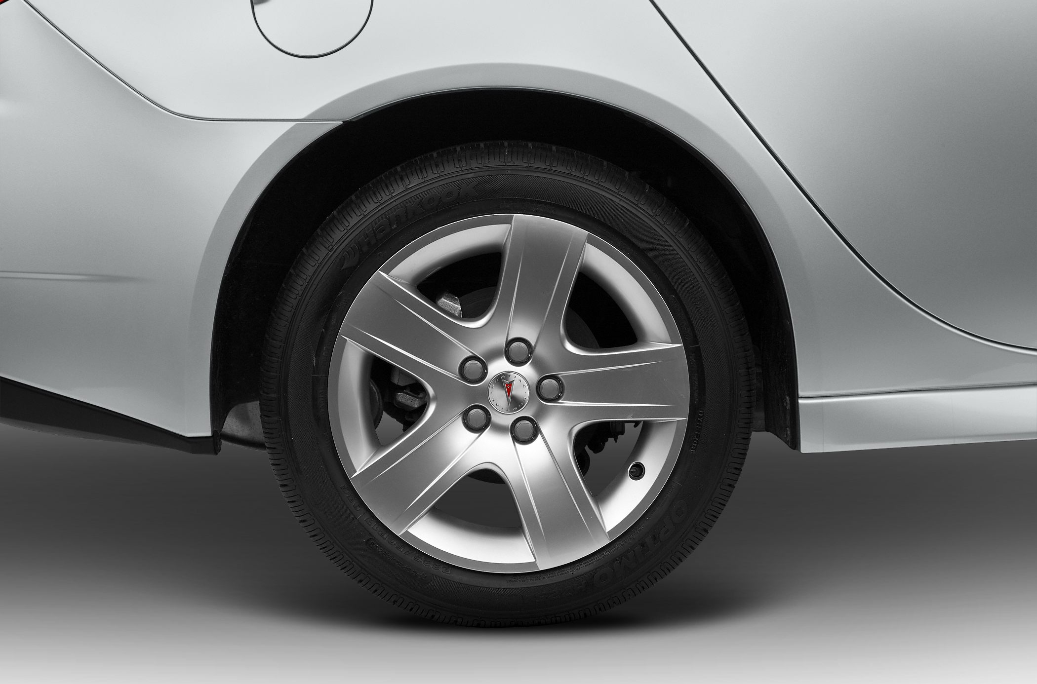 Alloy wheel and rear quarter panel with silver body and tire details