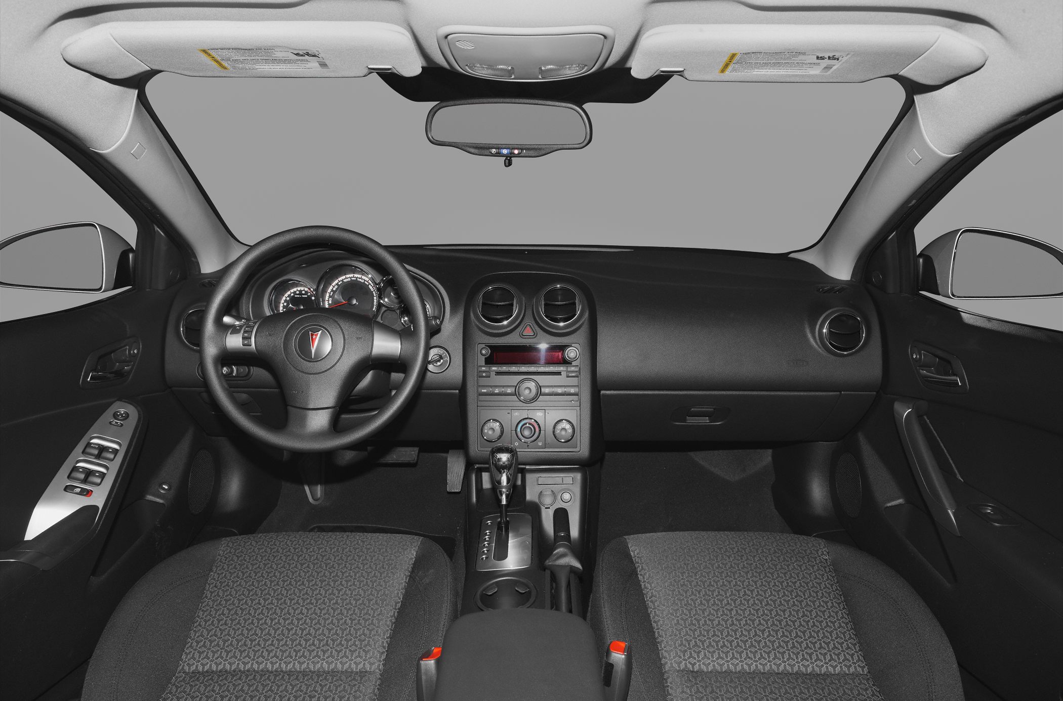 Dashboard, steering wheel, and central console interior view