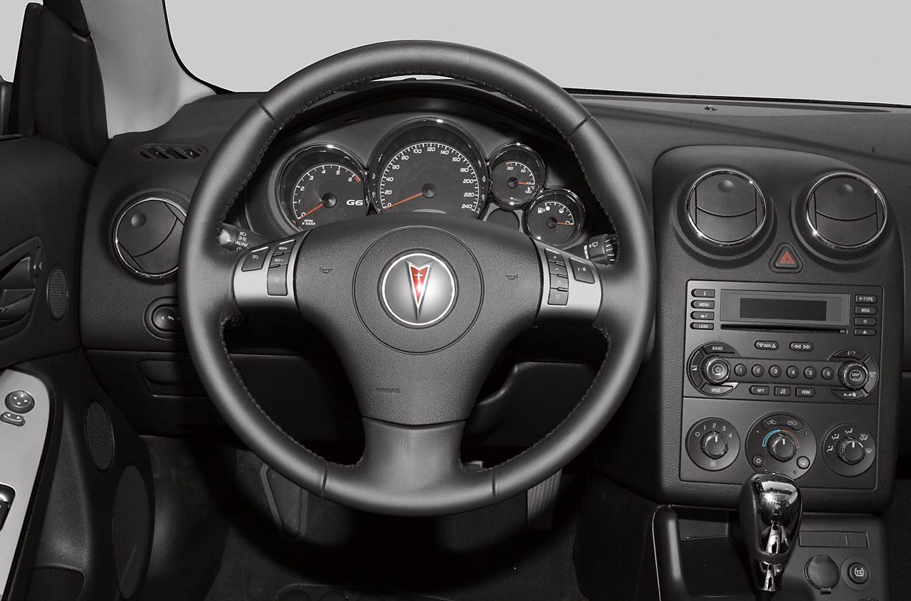 Interior dashboard with steering wheel and instrument cluster