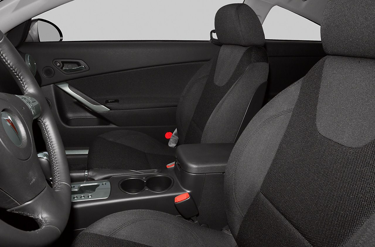 Front seats and center console in coupe interior