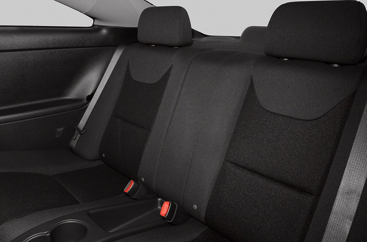 Rear seat with black fabric upholstery and integrated headrests