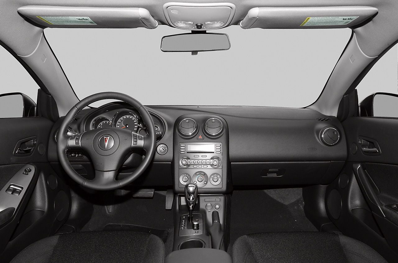 Car interior dashboard with steering wheel and center console