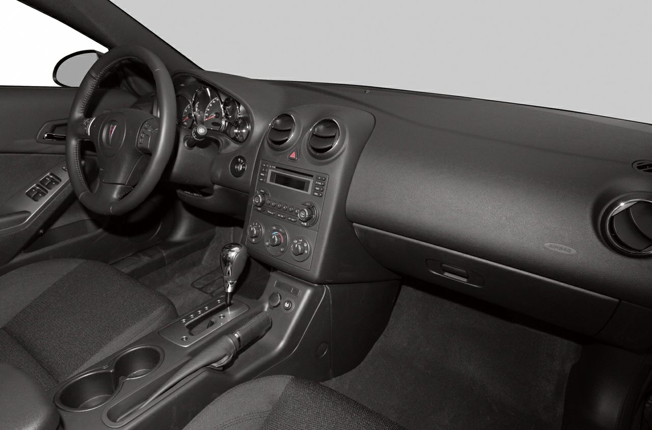 Dashboard, steering wheel, gear shift and center console interior view