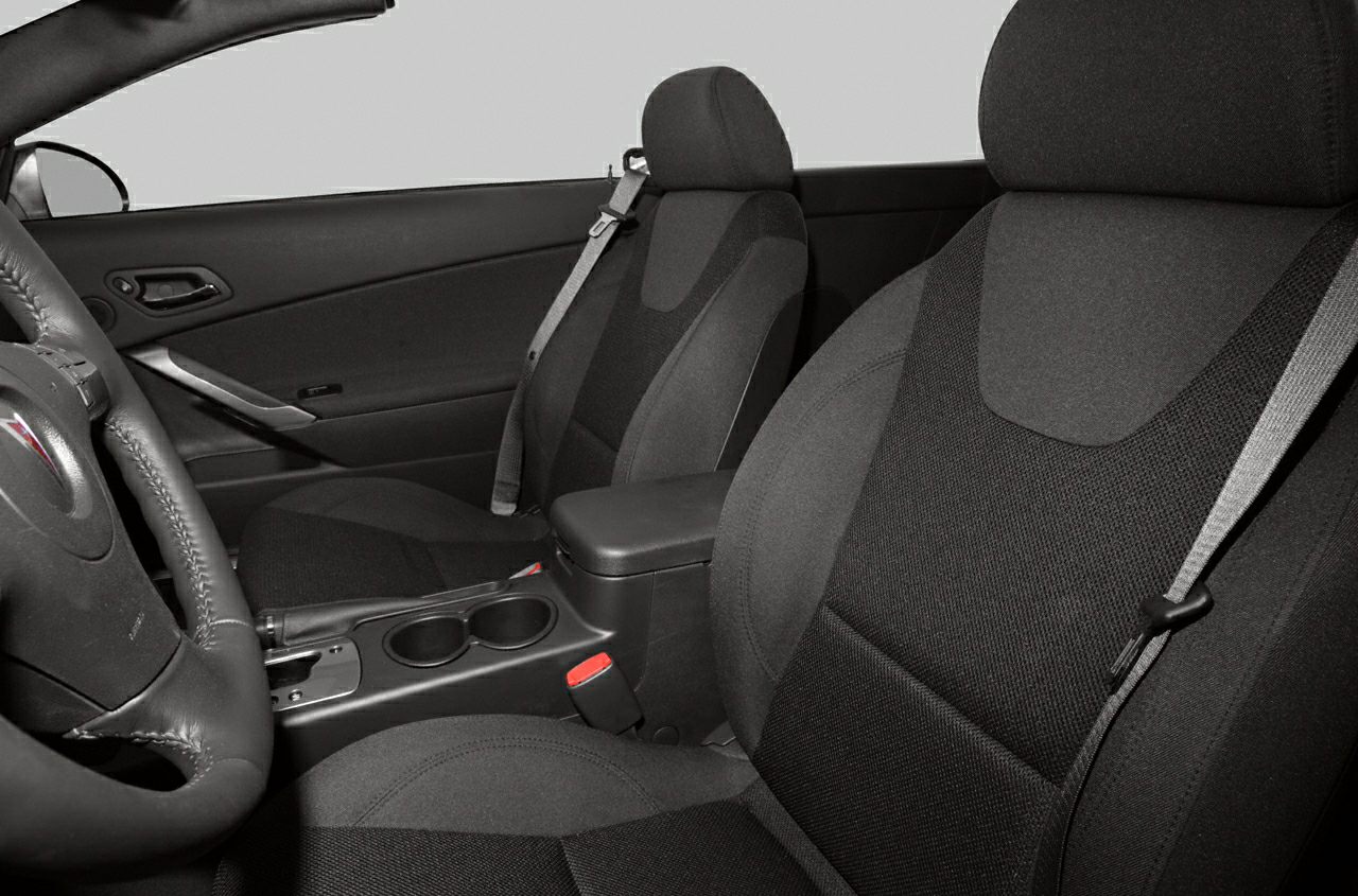 Interior seats and center console with cup holders and armrest