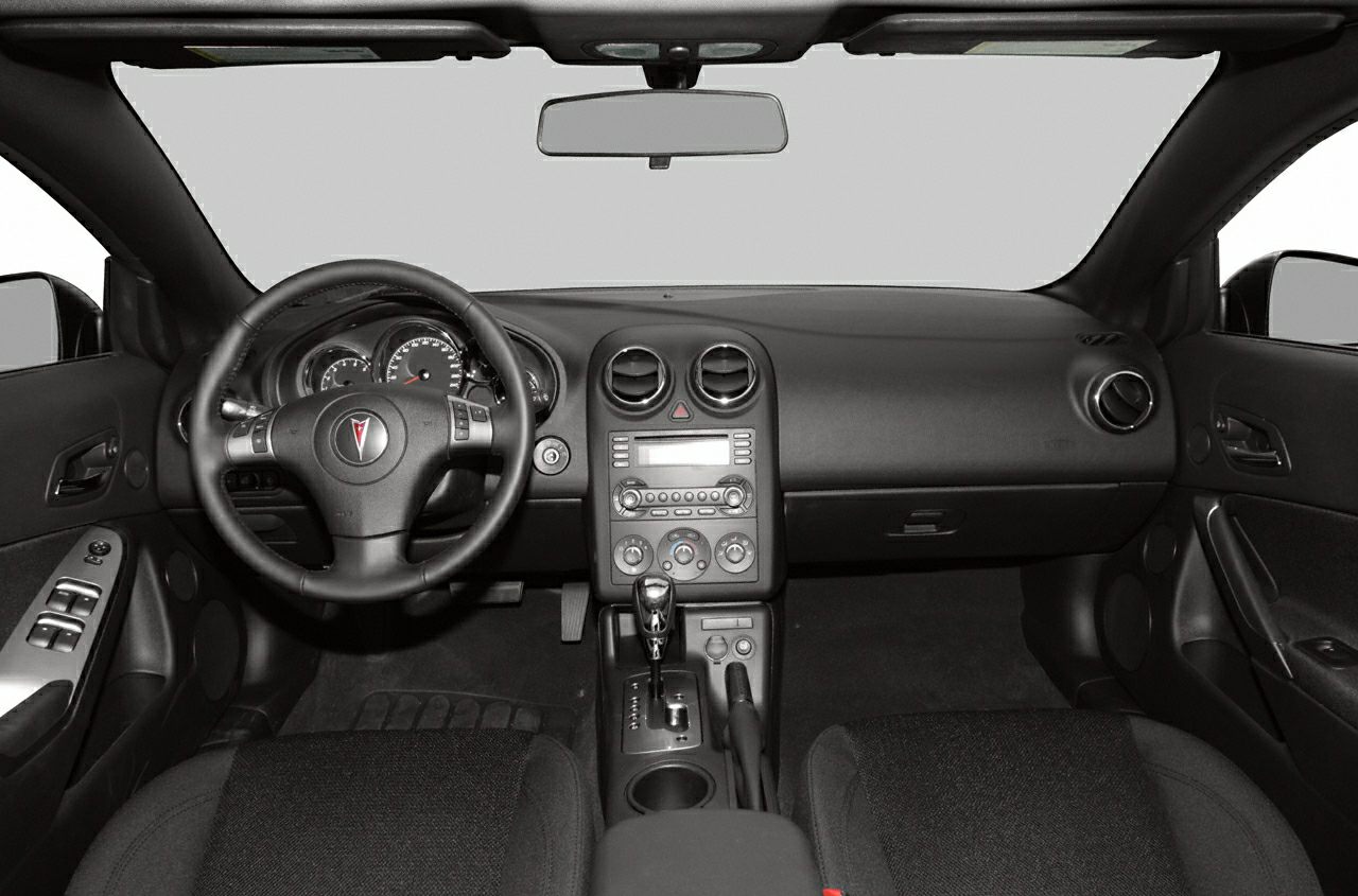 Dashboard and interior layout with steering wheel and control panel