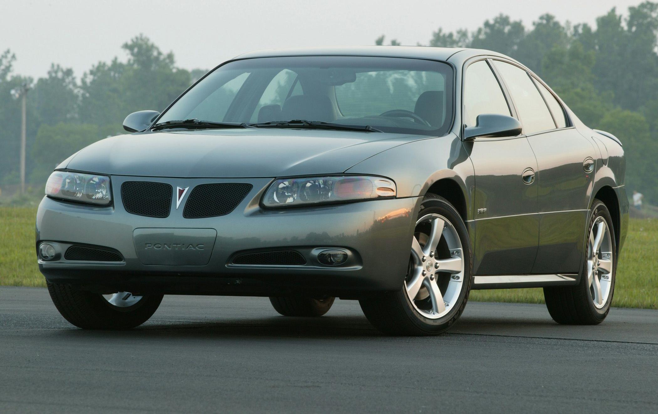 Front and side view of a mid-size sedan with alloy wheels and sleek headlights