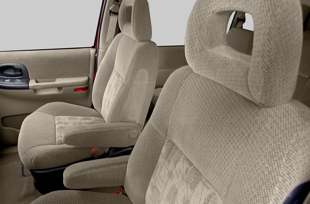 Beige cloth upholstered front seats with armrests and ergonomic headrests