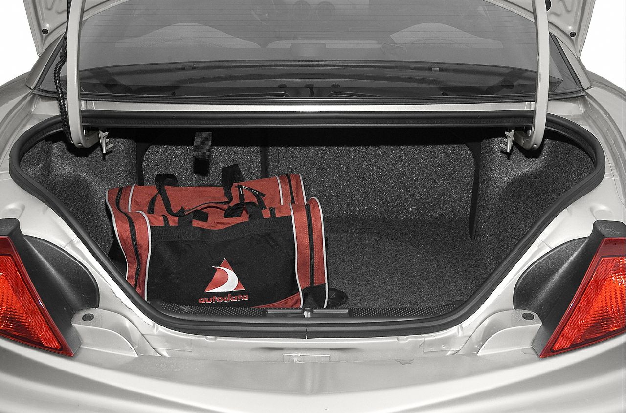 Open rear trunk with spacious interior and sports bag