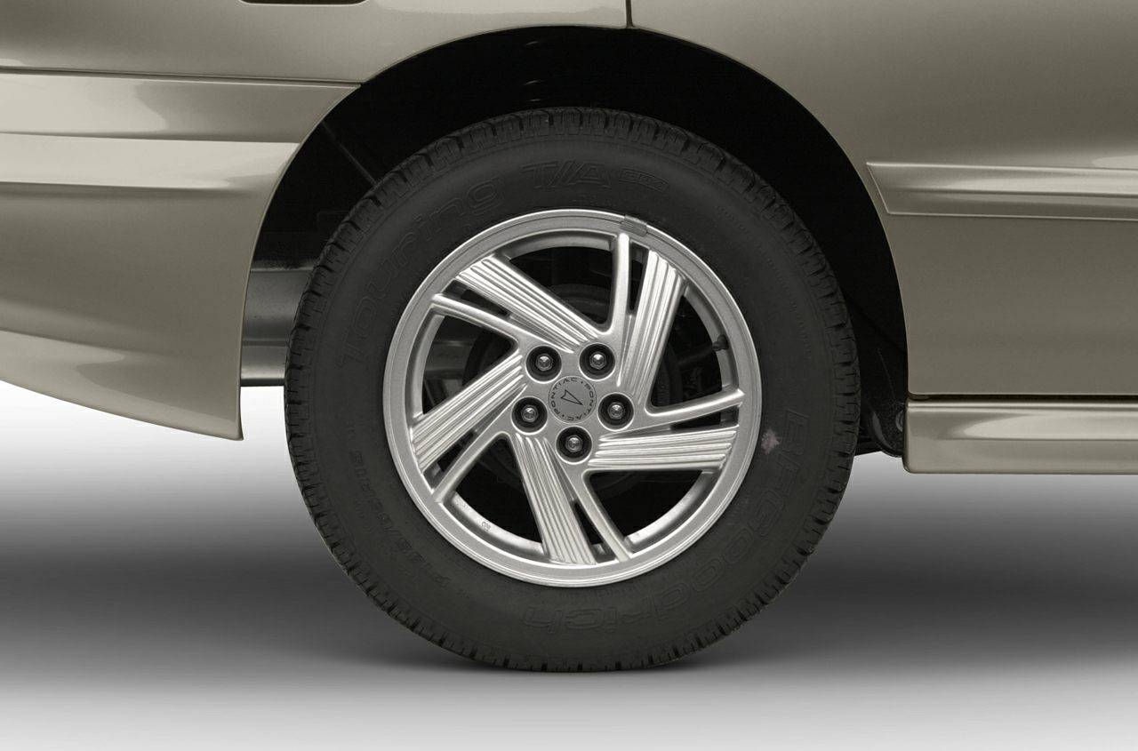 Close-up of alloy wheel and tire of a mid-1990s sedan
