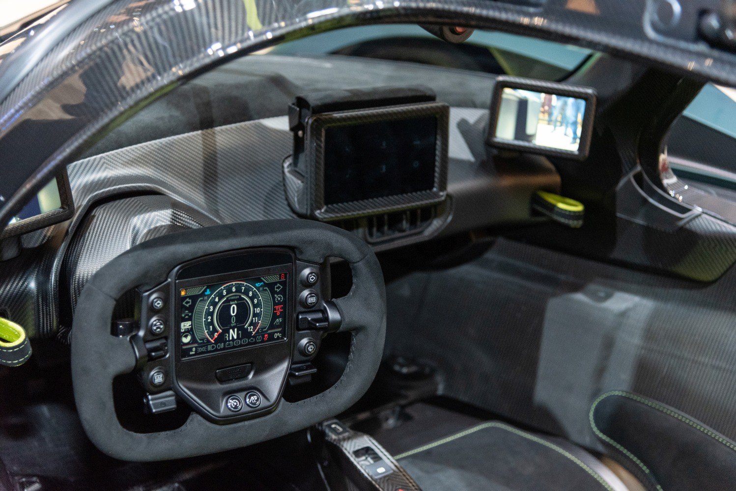 Digital steering wheel display with carbon fiber cockpit interior