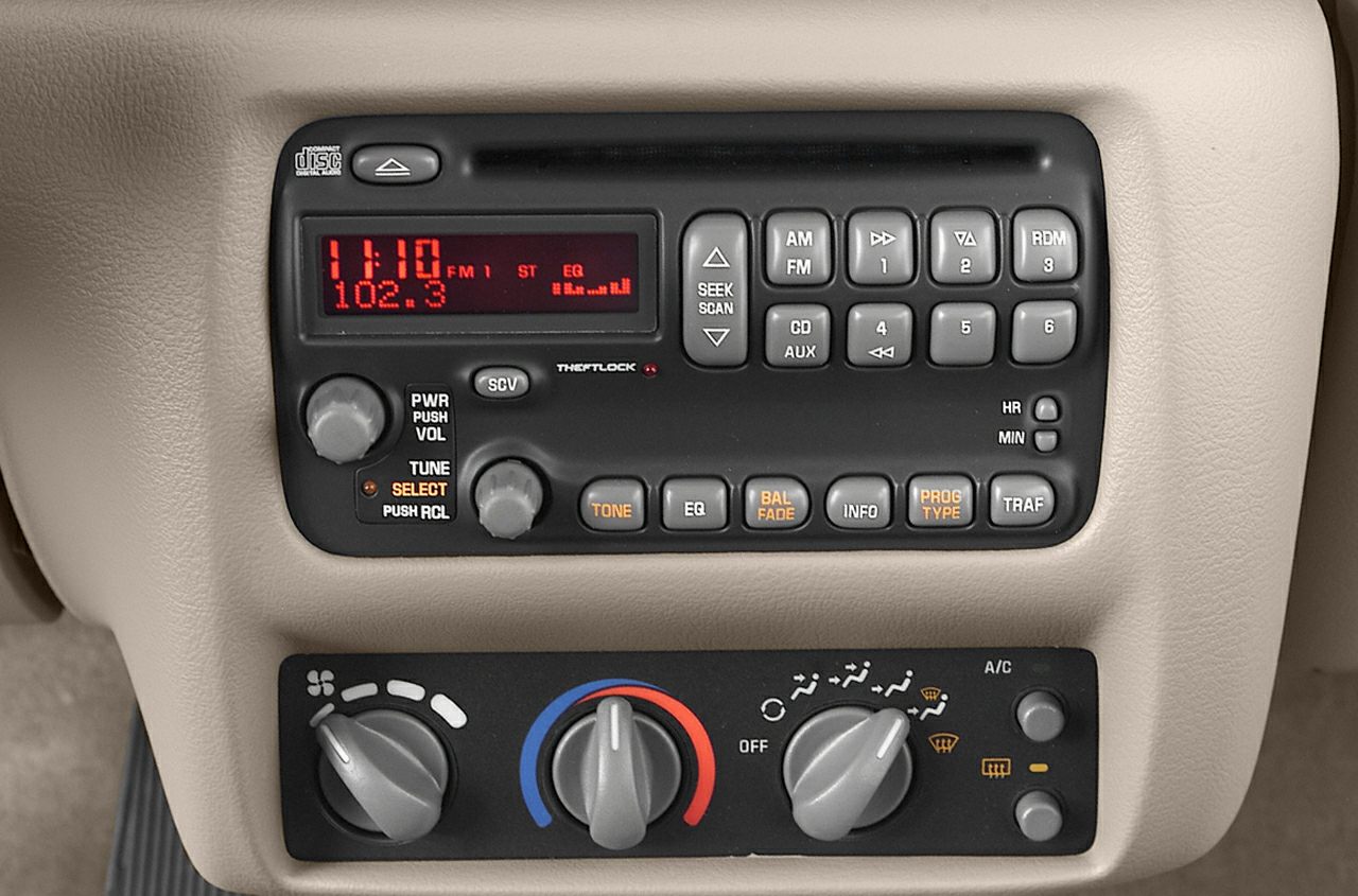 Classic car stereo with CD player and manual climate control knobs