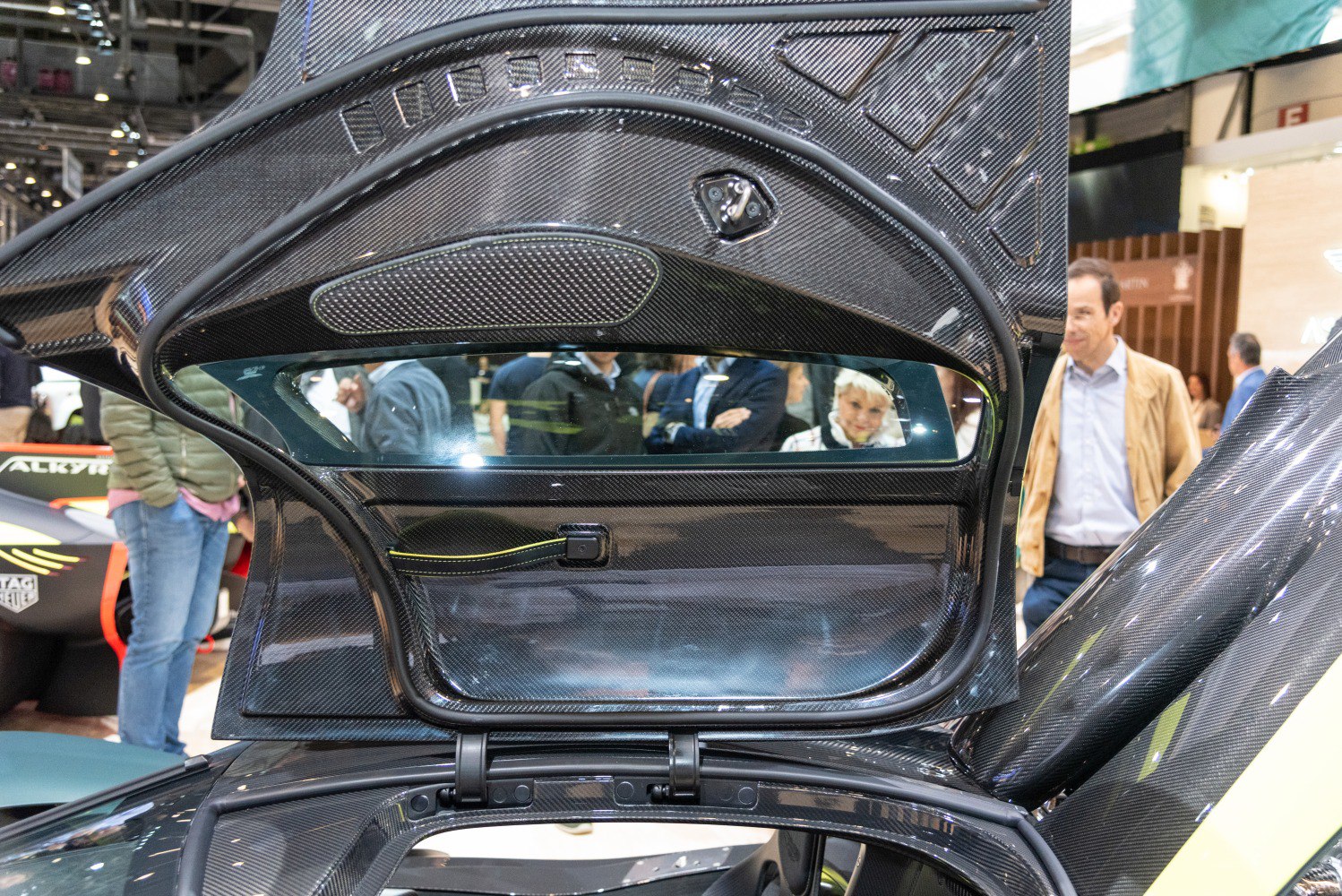Carbon fiber gullwing door interior with intricate detailing.