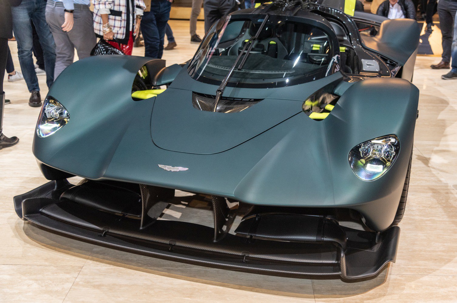 Aerodynamic front design with advanced headlights and carbon fiber splitter
