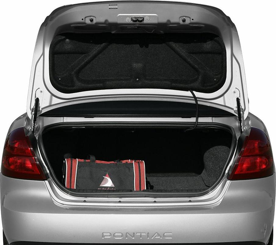 Open trunk showing rear cargo space with a bag inside.