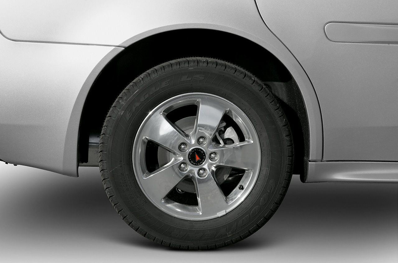 Close-up of Pontiac Grand Prix alloy wheel with visible brake disc