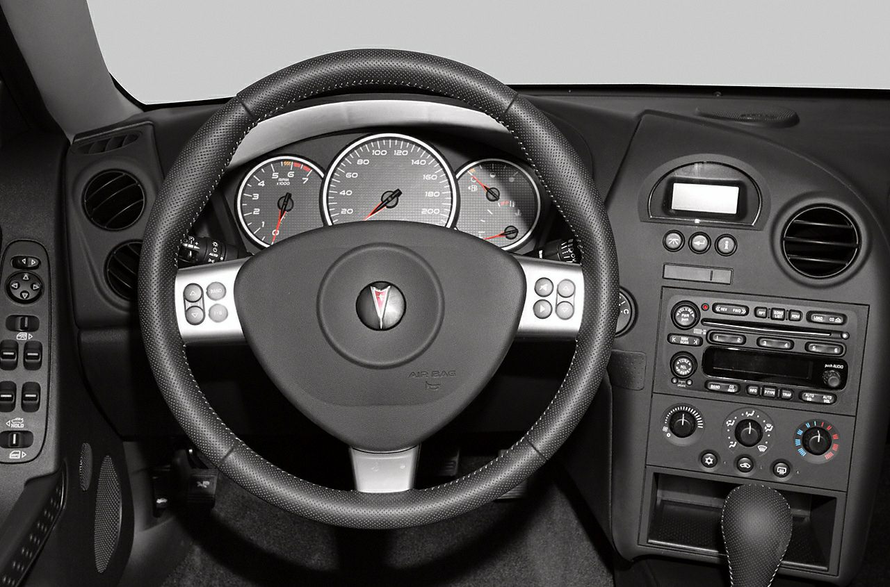 Steering wheel, instrument cluster, and center console of car interior