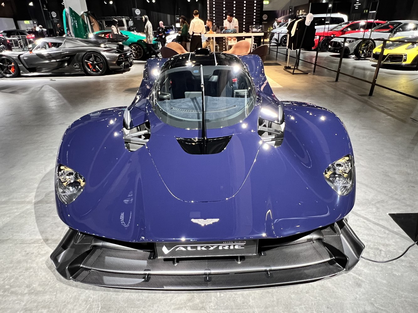 Front aerodynamic design with carbon fiber splitter and sleek cockpit.