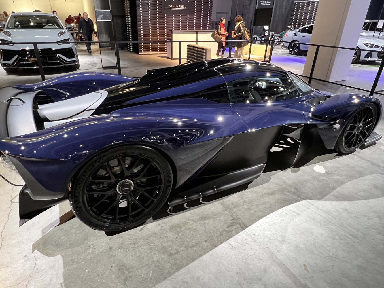 Aerodynamic side profile with sleek bodywork and black wheels