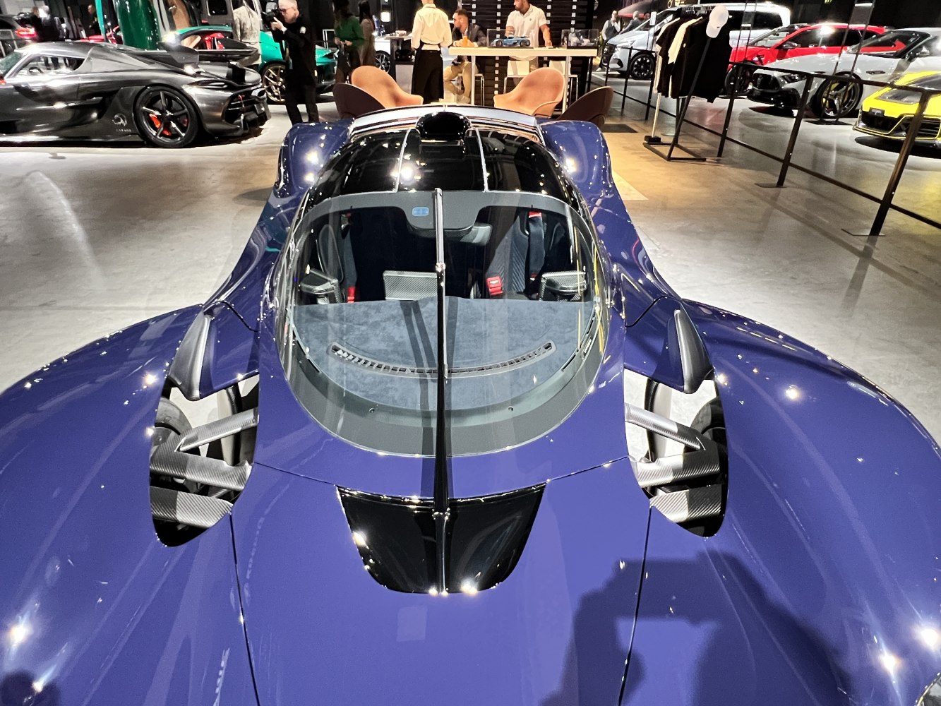 Close-up of aerodynamic design with unique central cockpit and airflow channels