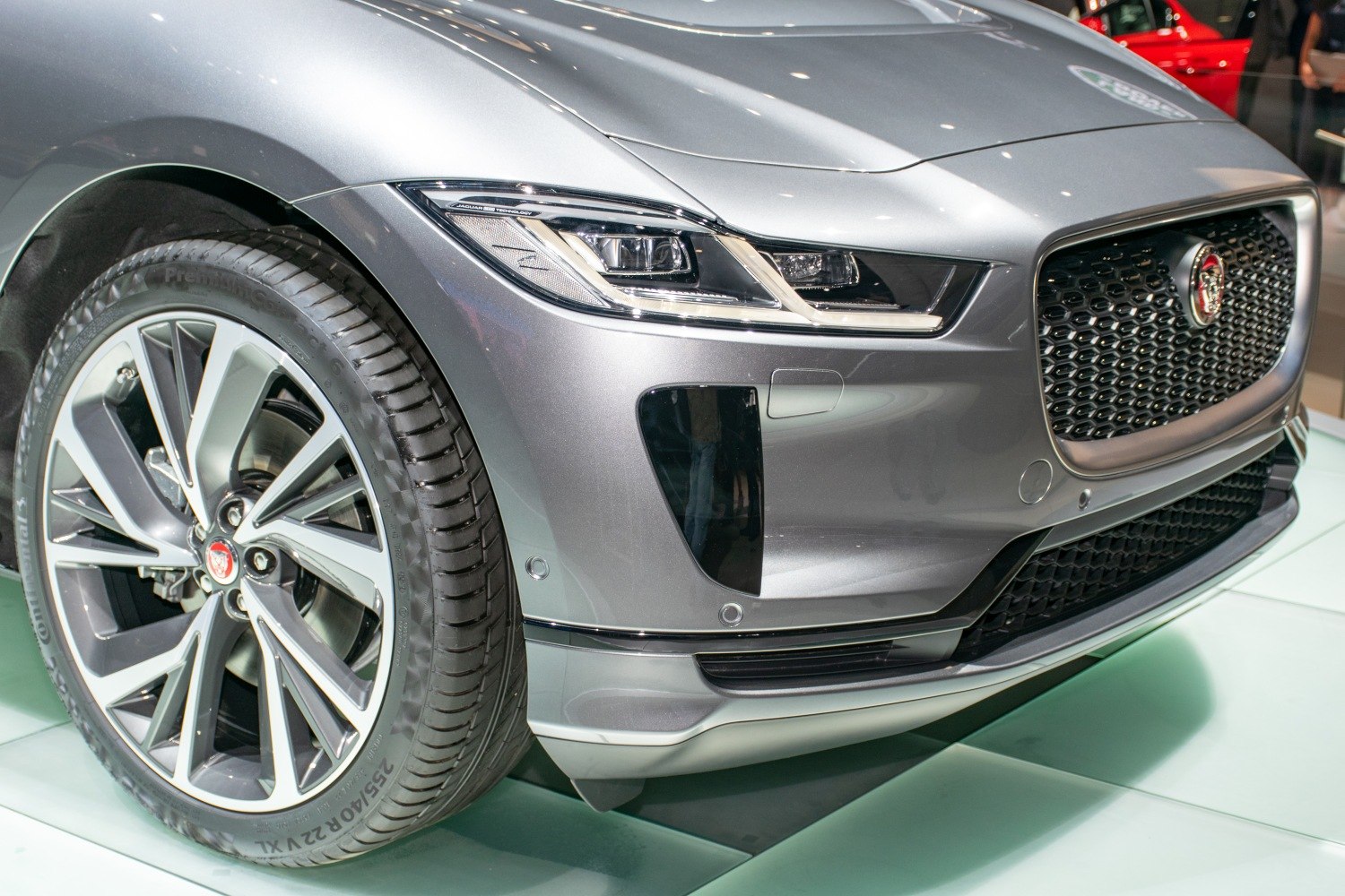 Close-up of LED headlights, alloy wheel, and front grille