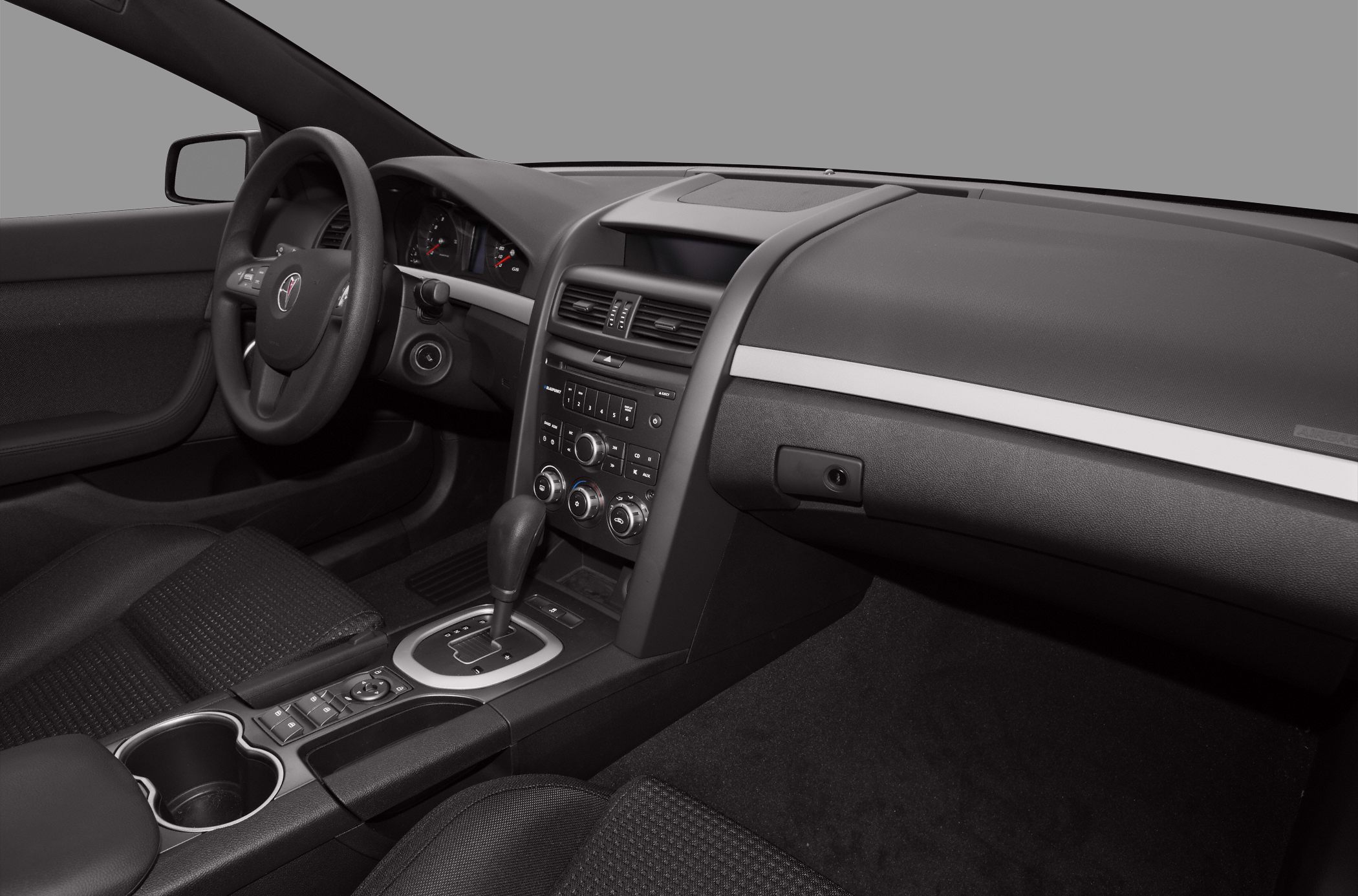 Car interior with dashboard, climate controls and automatic gearshift