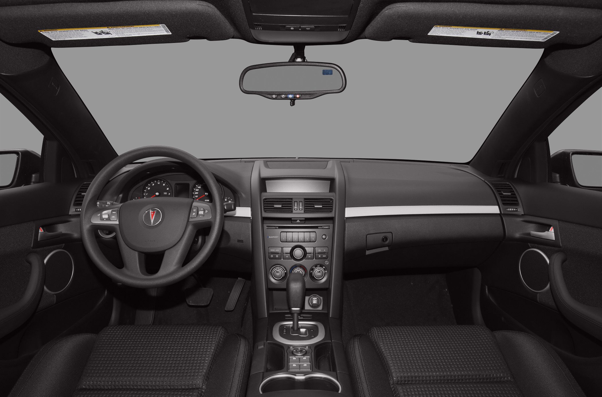 Dashboard, steering wheel with controls, central console, gear shift