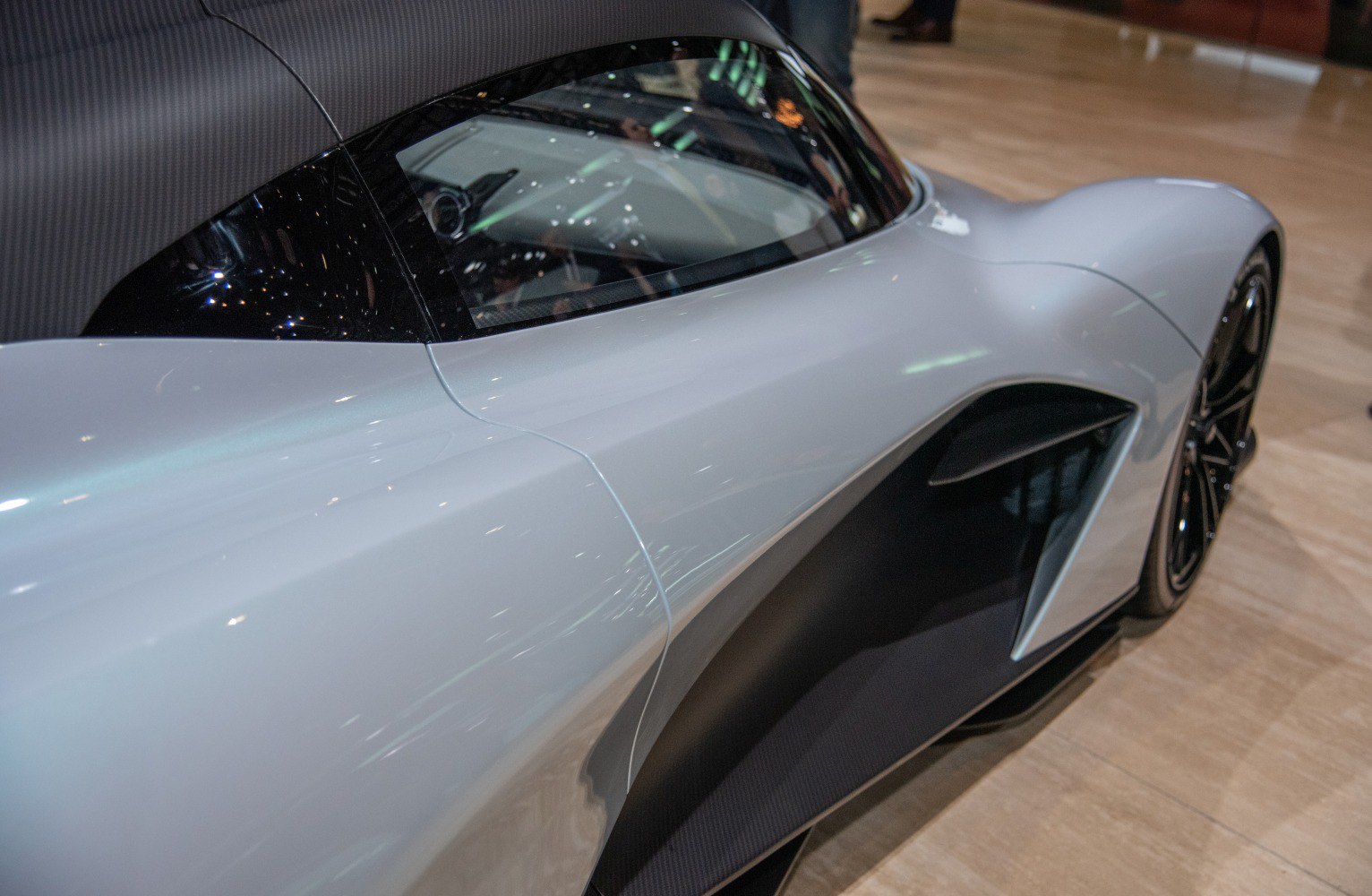 Side profile with aerodynamic air intake and sleek body lines