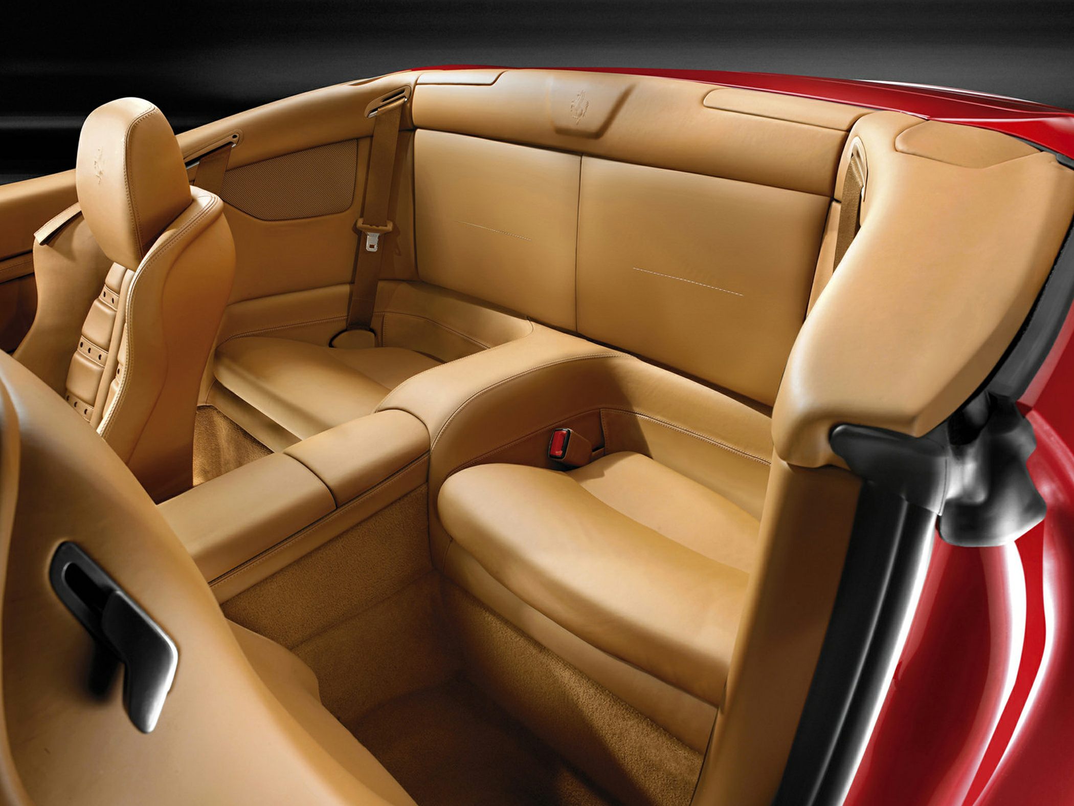 Plush rear tan leather seats with detailed stitching and elegant design