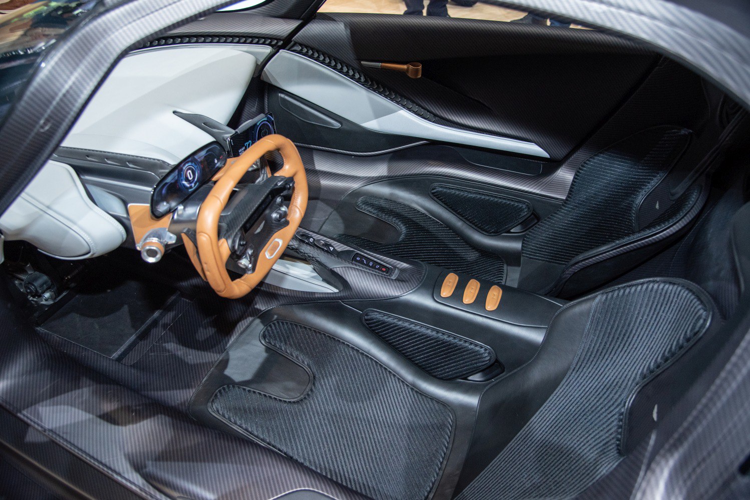 Carbon fiber interior, digital dashboard, racing steering wheel, racing seats