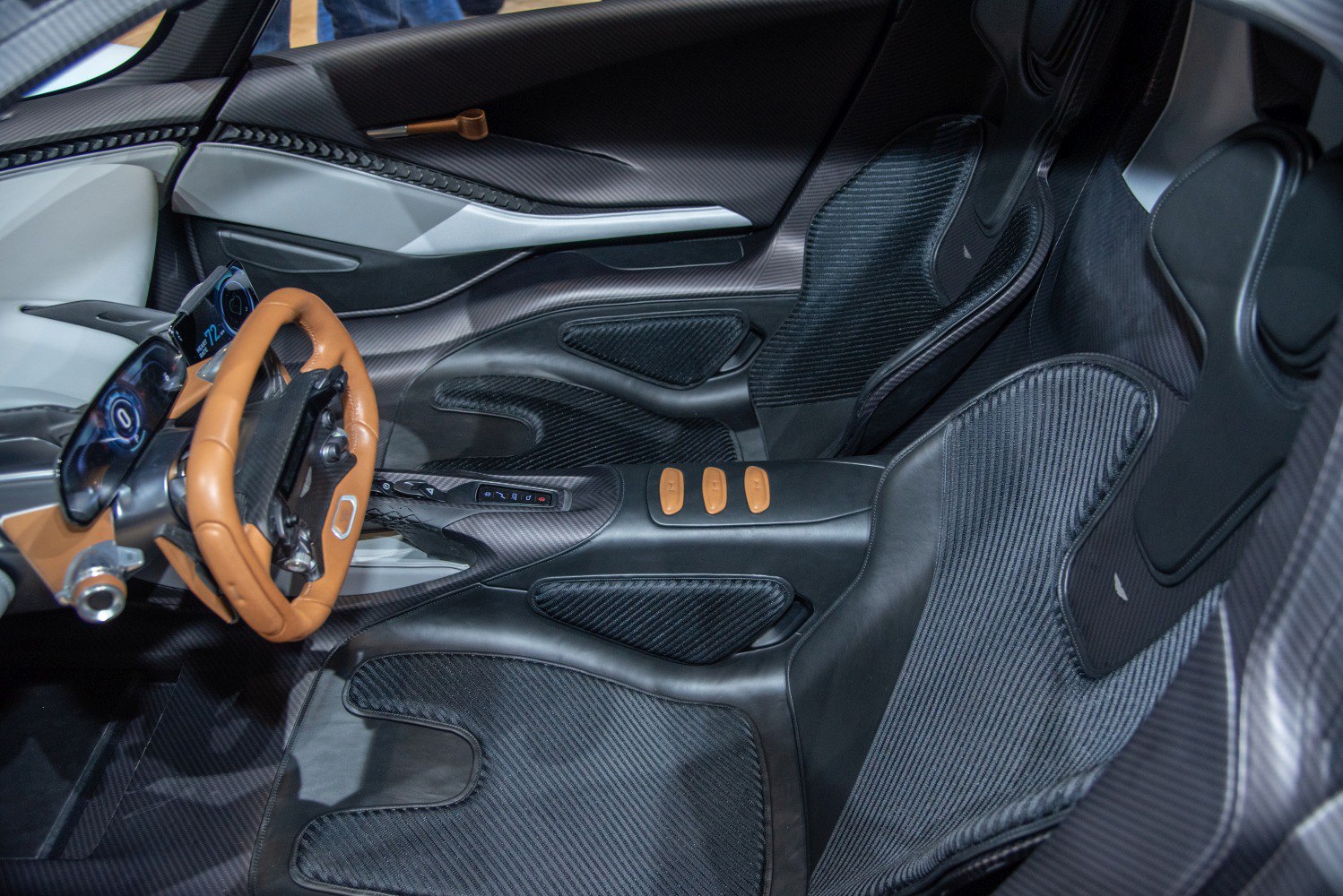 Carbon fiber bucket seats with sporty steering wheel and modern interior design