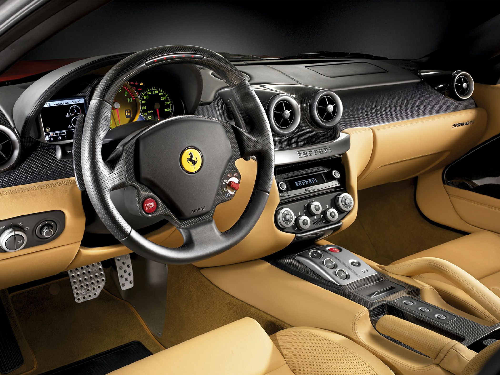 Carbon fiber dashboard and tan leather seats with sporty controls