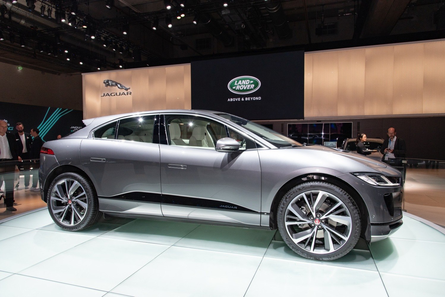 Side profile of a sleek electric SUV with aerodynamic design and luxury features