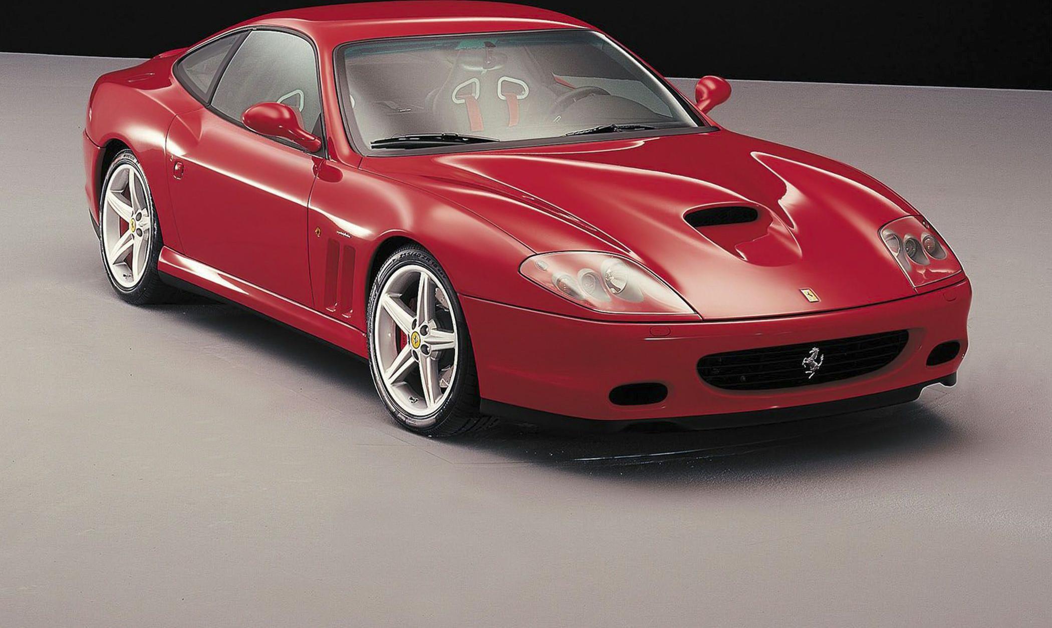 Sleek sports coupe with prominent hood scoop and alloy wheels.