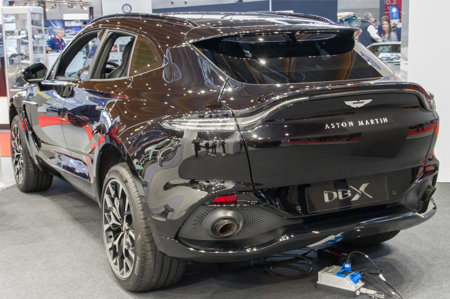 Rear view highlighting tail light, exhaust, and rear spoiler design