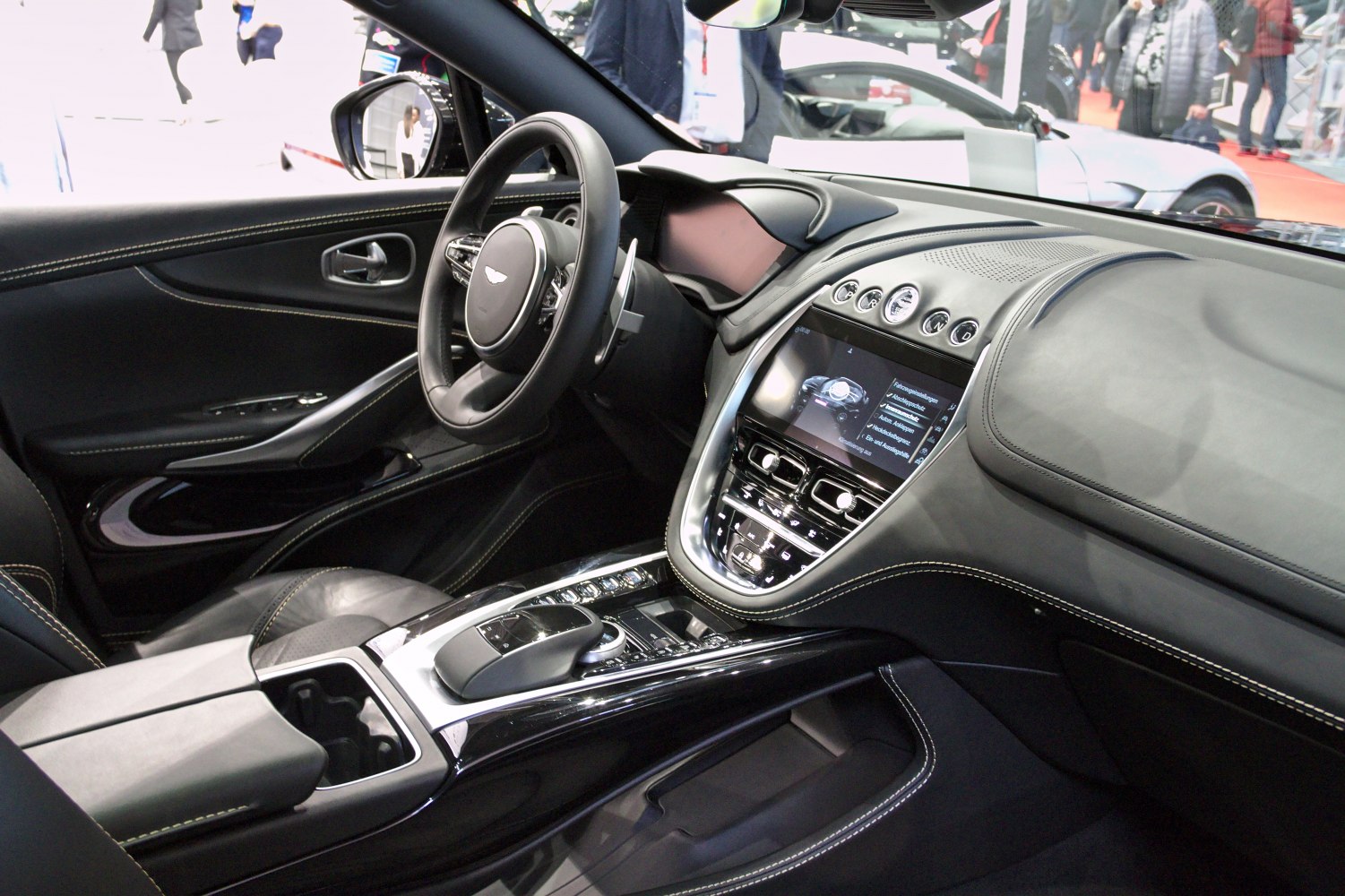 Luxury dashboard with digital display and leather-wrapped steering wheel