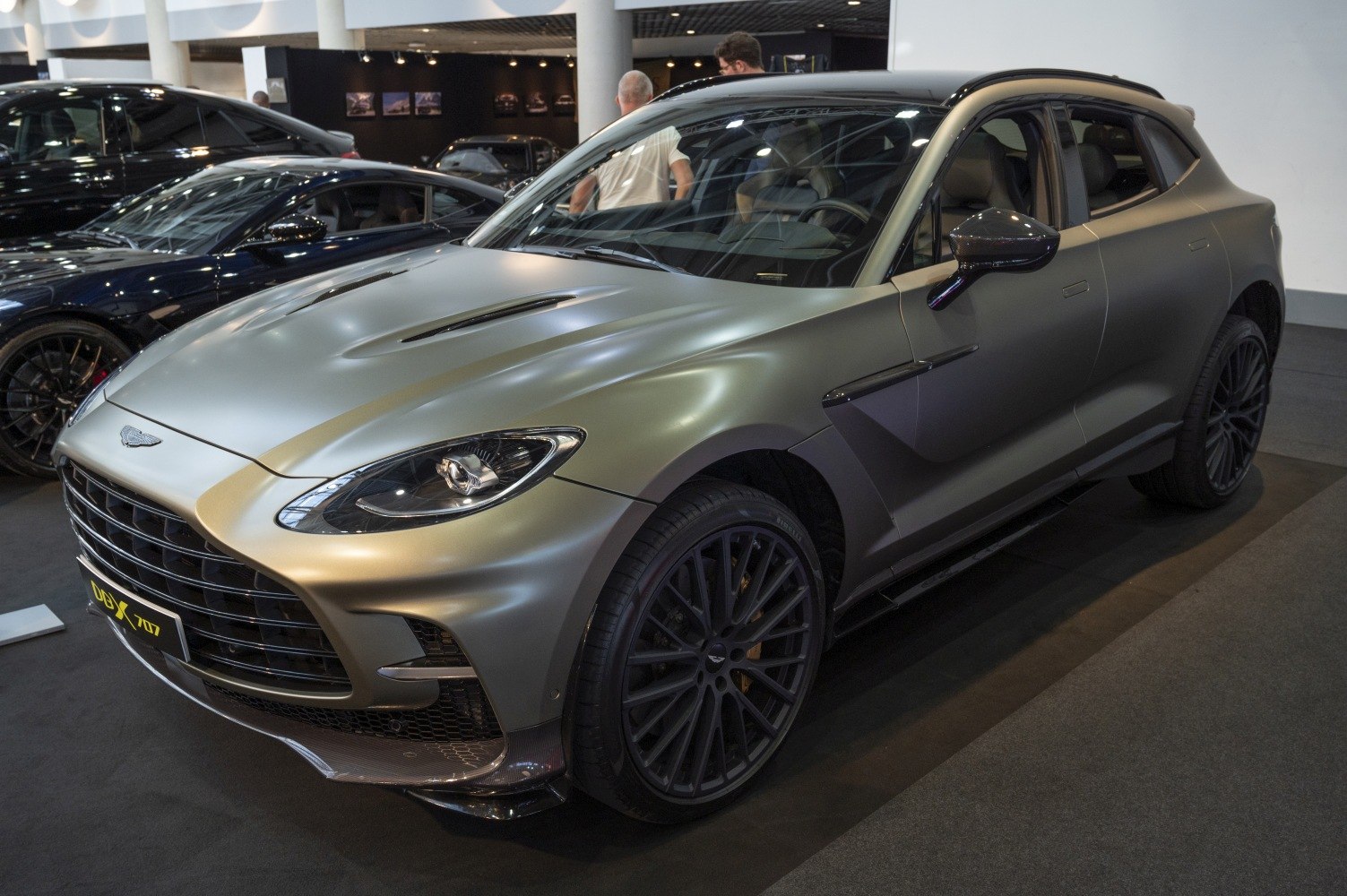 Front and side view of luxury SUV with bold grille and aerodynamic styling