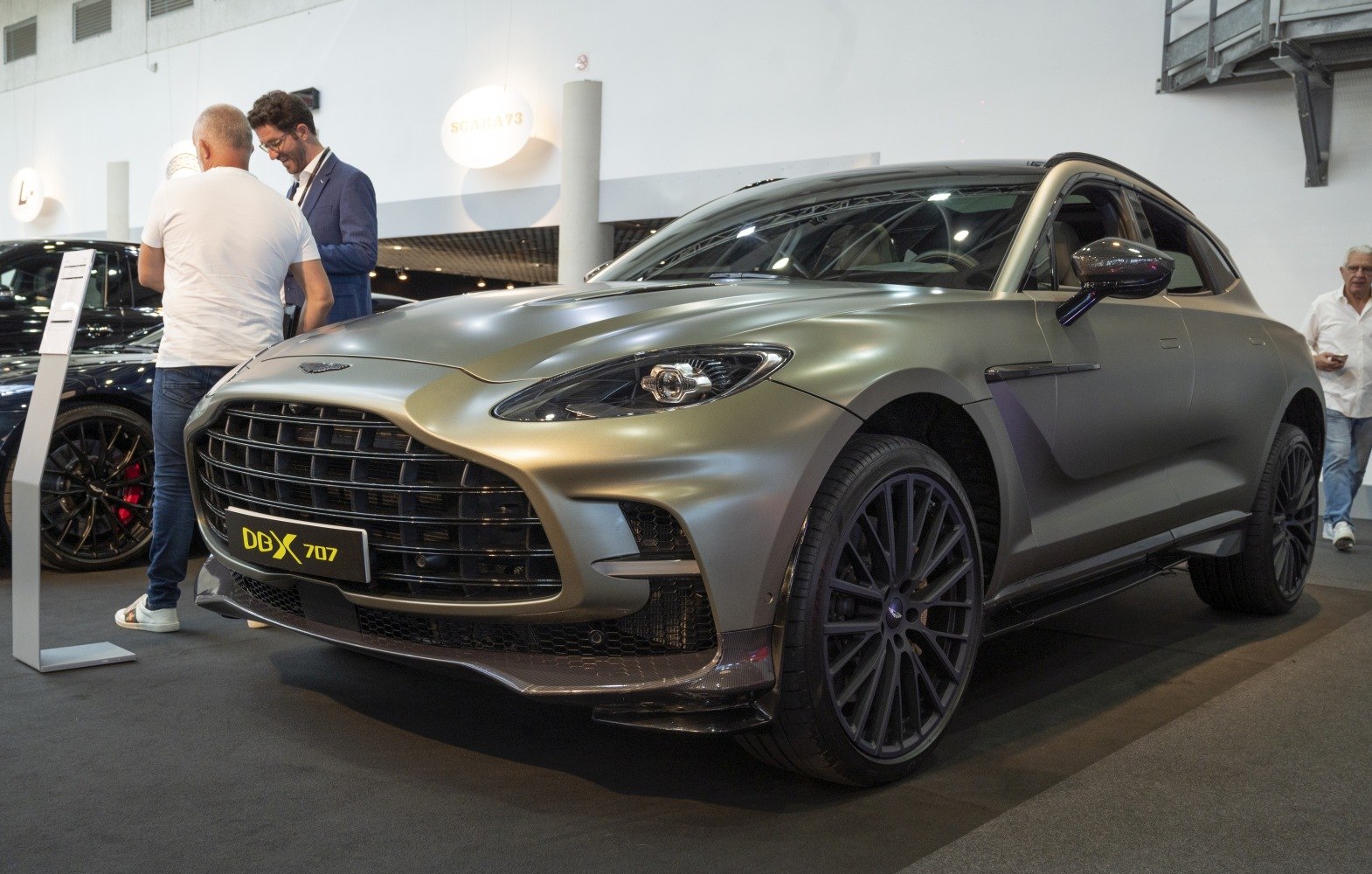 Aggressive front grille and large wheels of SUV