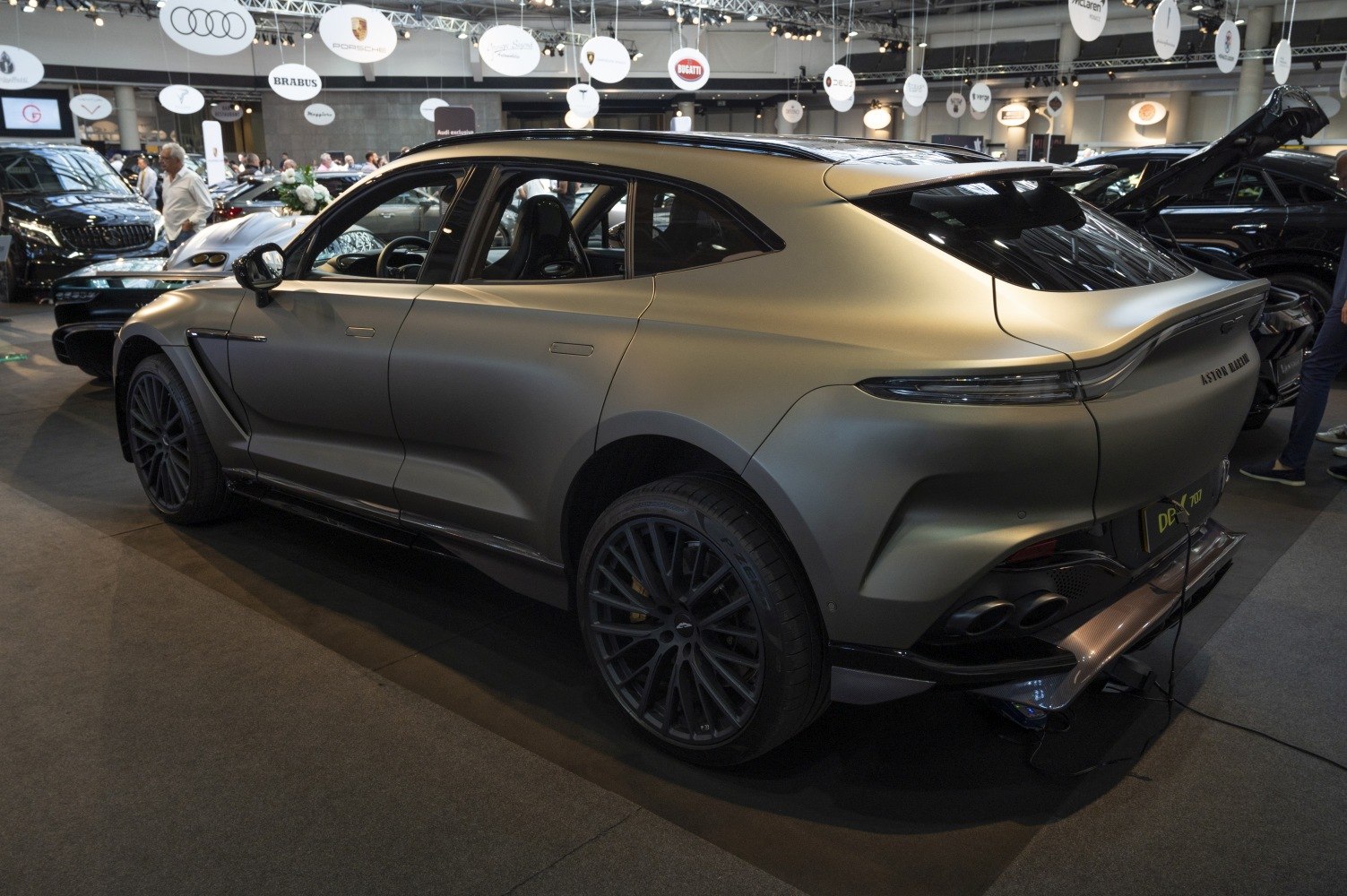 Sleek rear side profile of a modern luxury SUV with large alloy wheels and tinted windows