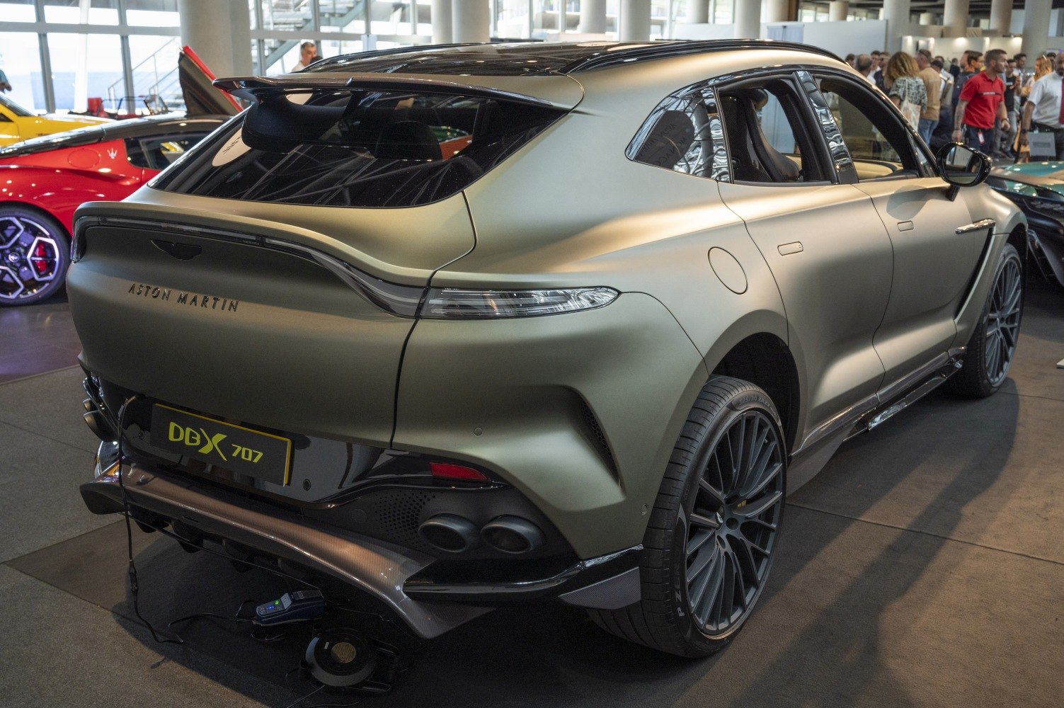 Rear view of SUV with aerodynamic spoiler and quad exhausts