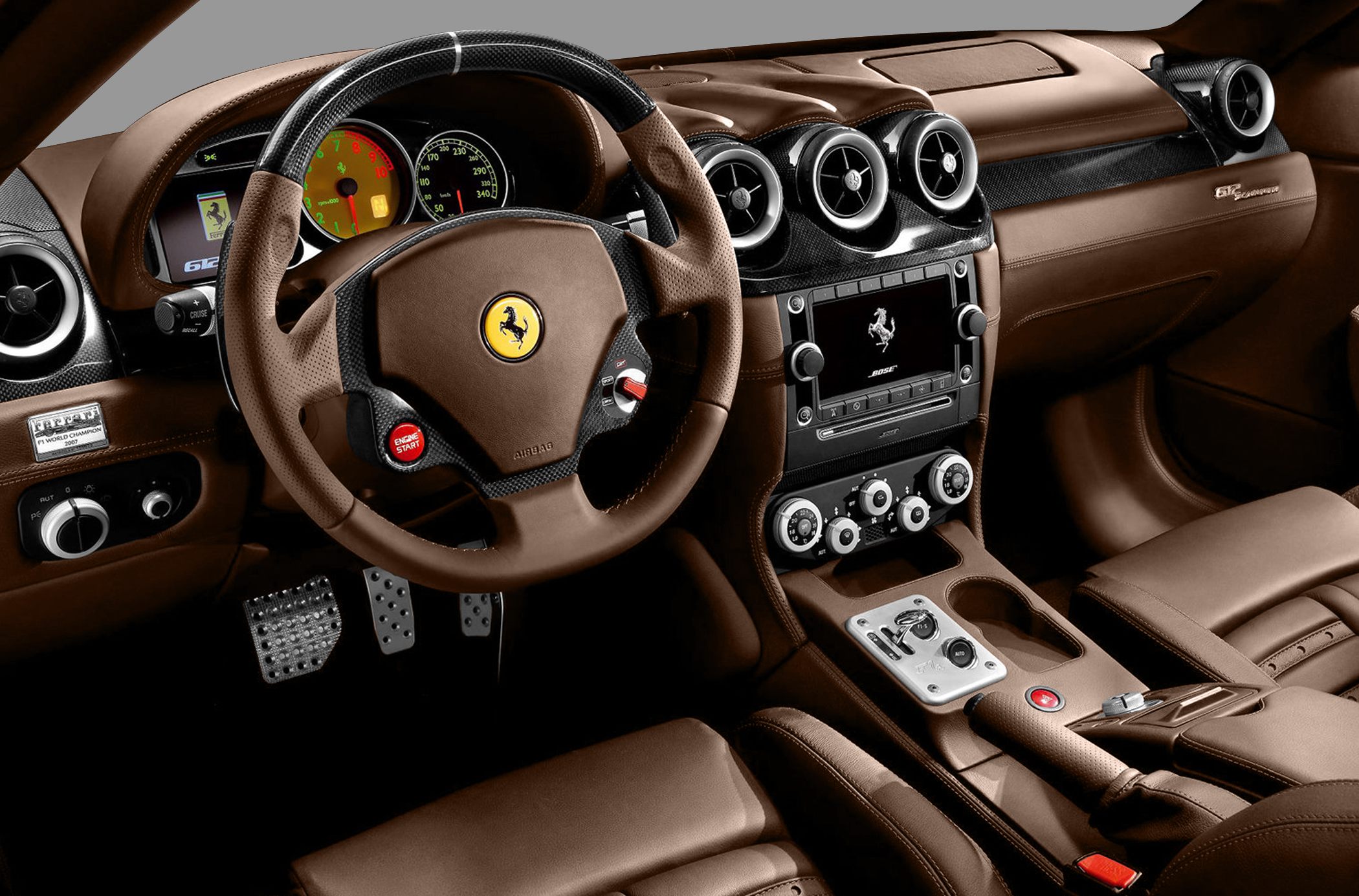 Brown leather interior with carbon fiber dashboard and detailed steering wheel.