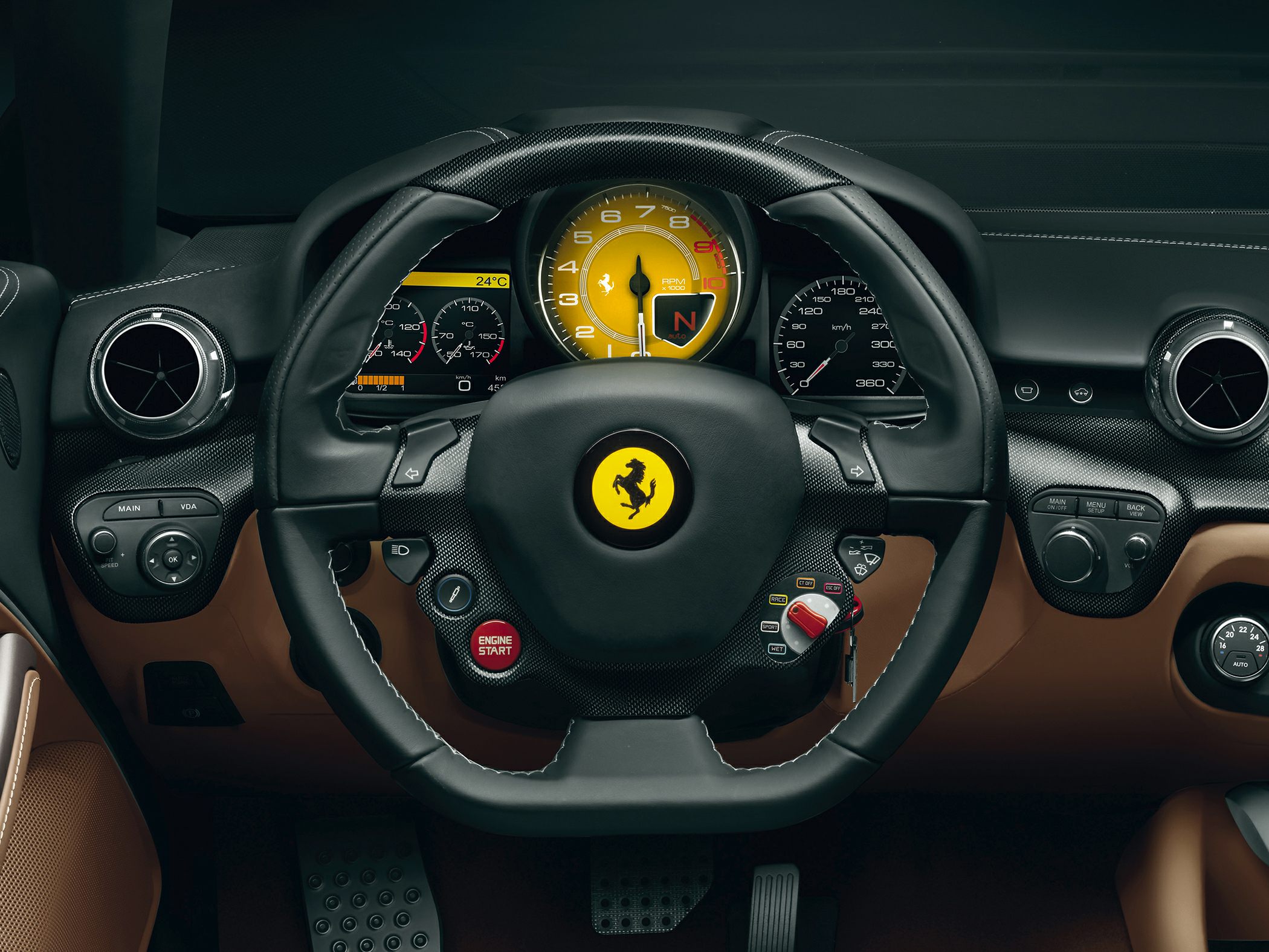 Steering wheel with yellow tachometer and integrated controls