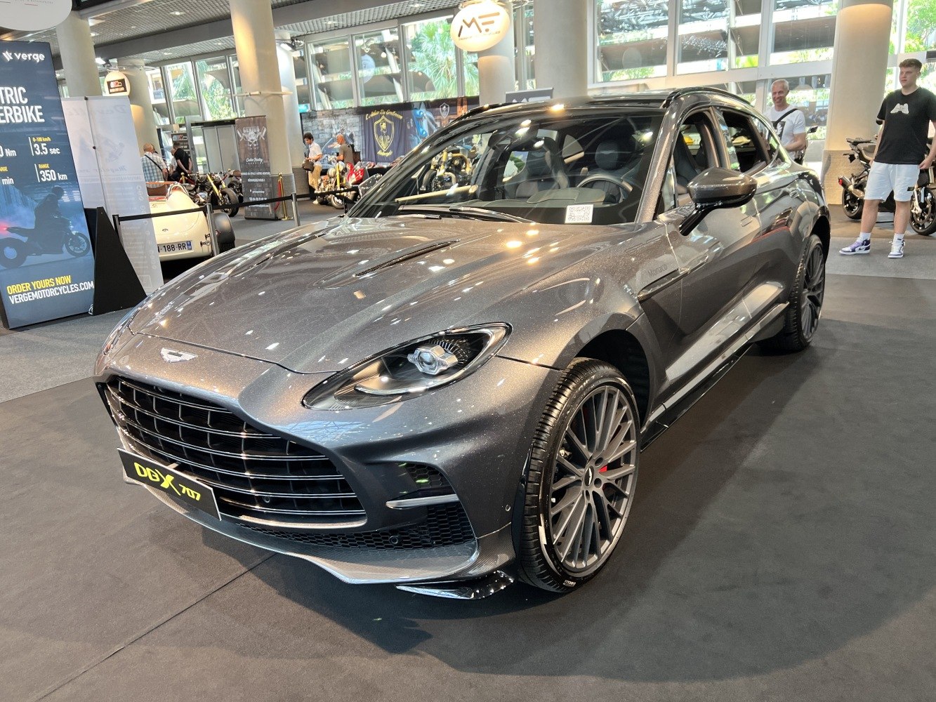 Metallic grey luxury SUV with distinctive grille and sporty alloy wheels