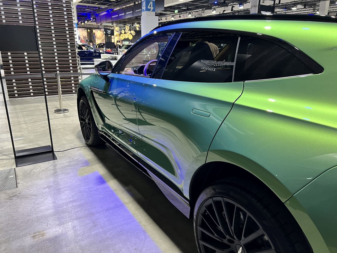 Side profile with gradient green paint and black alloy wheels