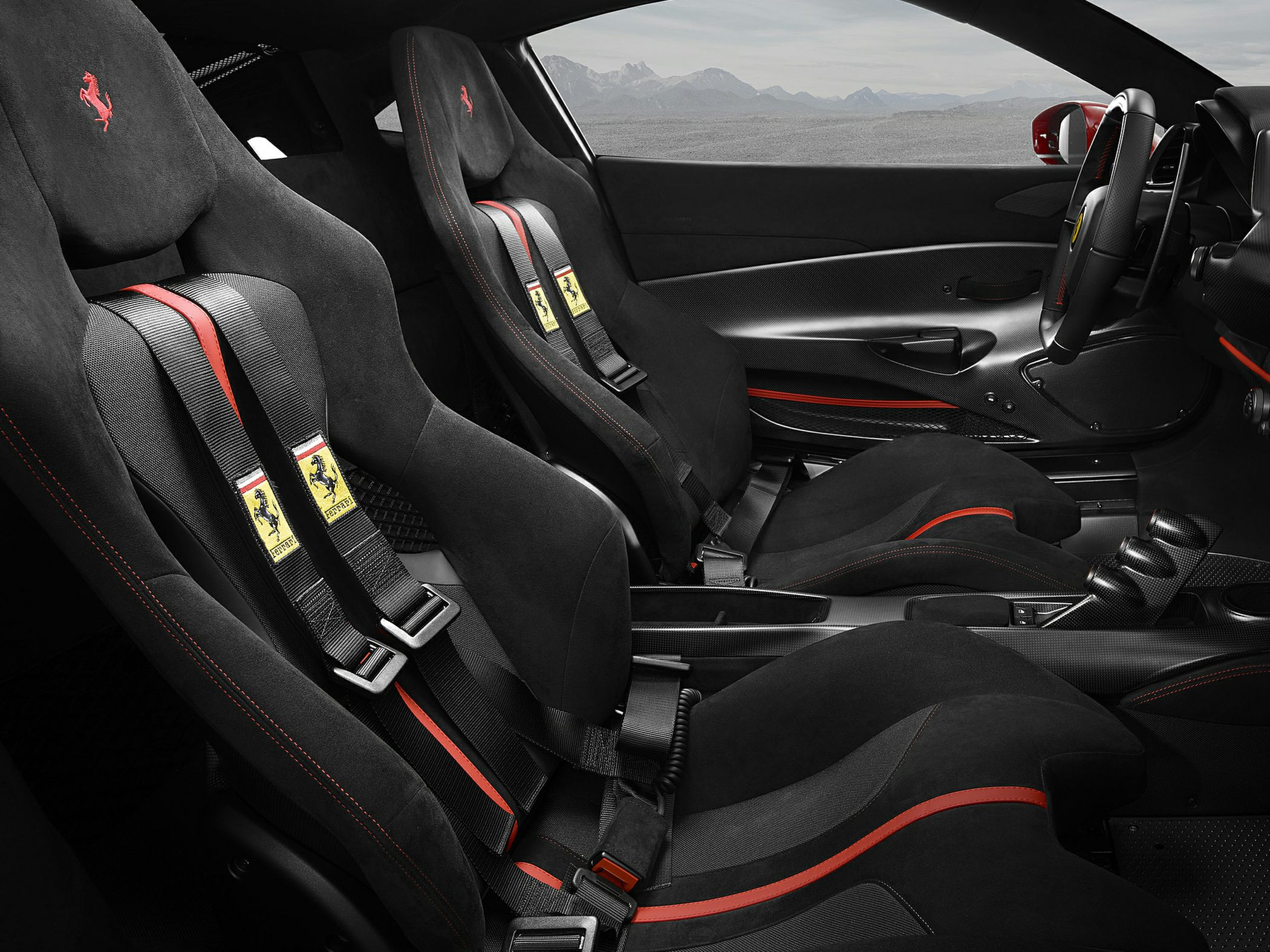 Racing seats with harness belts and sporty interior trims