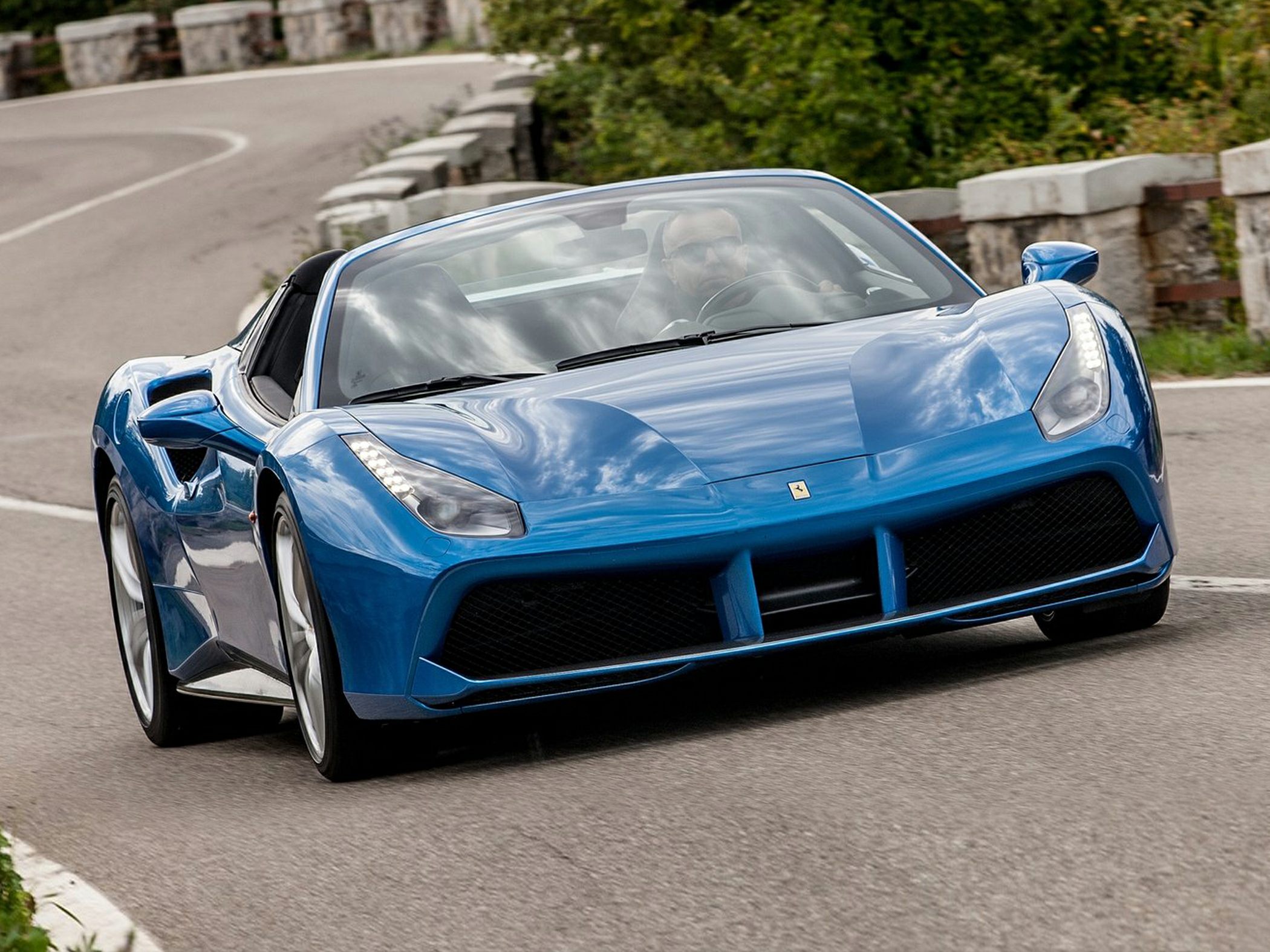 Convertible sports car with sleek front and LED headlights