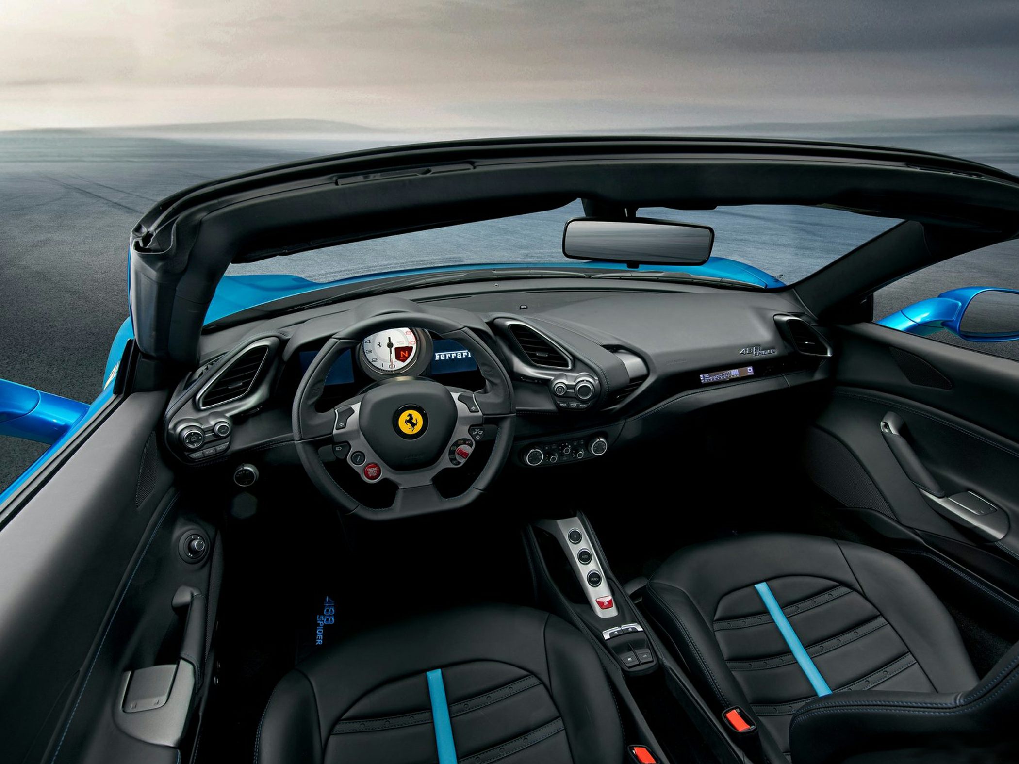 Convertible sports car interior with dashboard and steering wheel