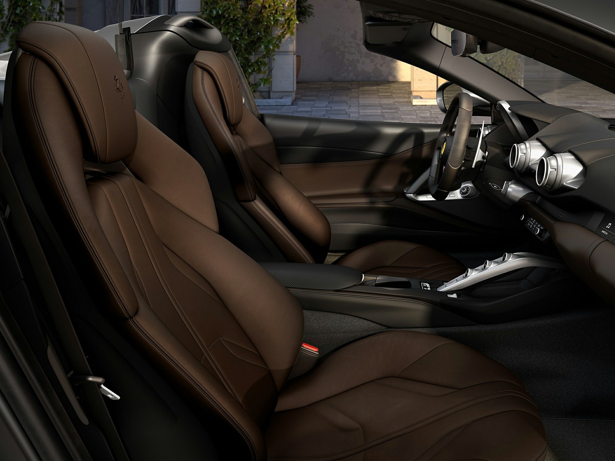 Brown leather seats and modern dashboard with sporty vents