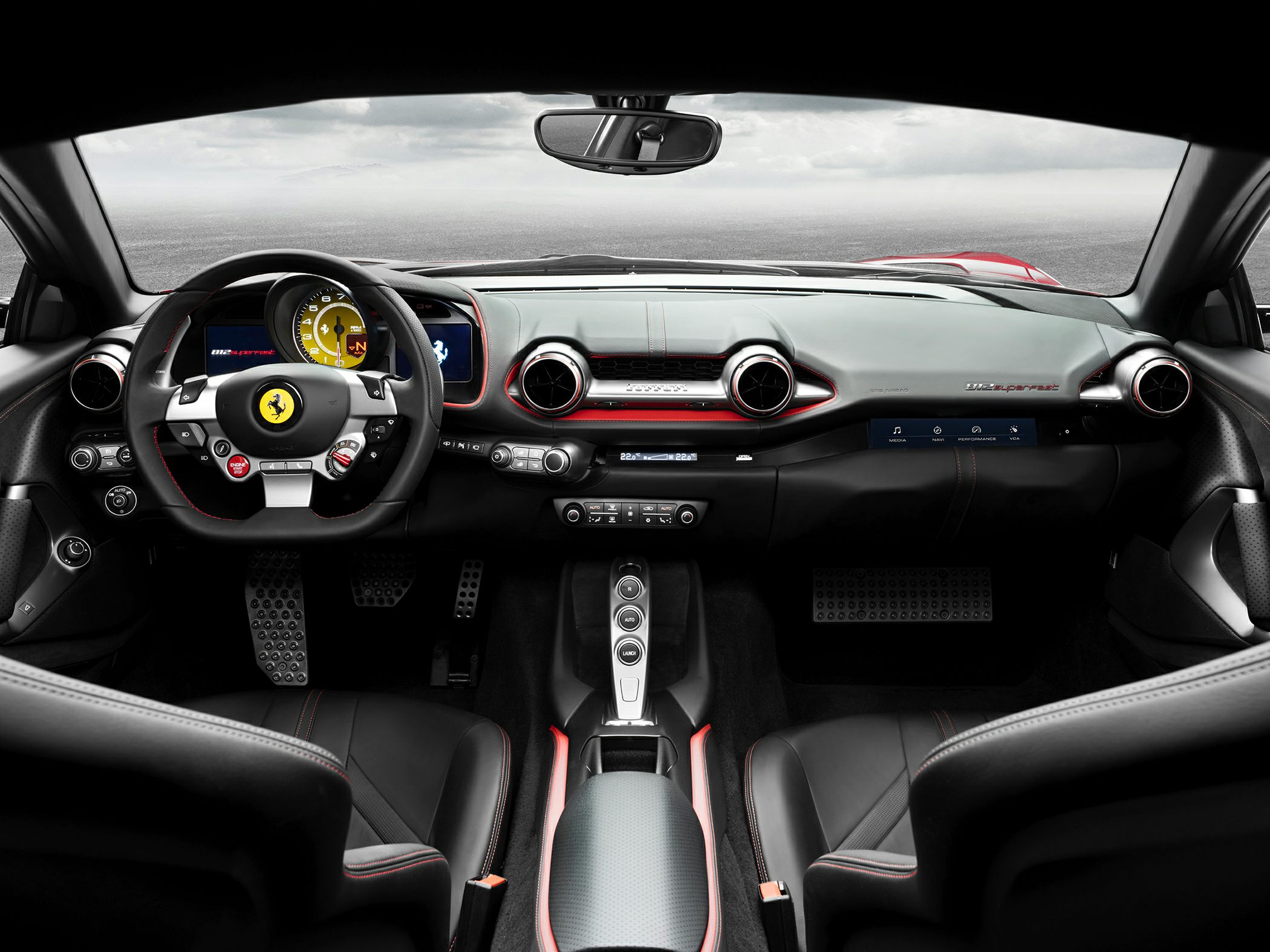 Luxury sports car interior with sporty steering wheel and high-tech dashboard