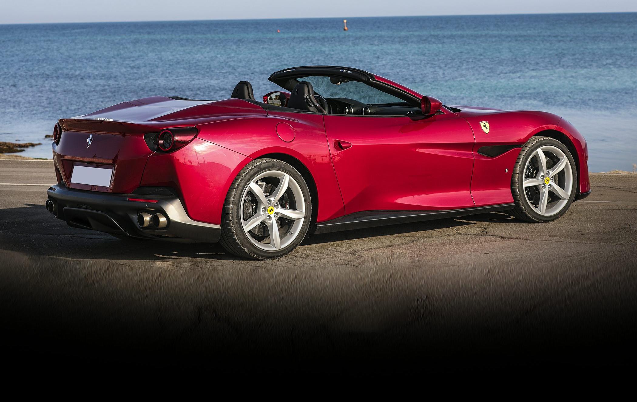 Convertible sports car rear side view with alloy wheels and distinctive tail lights
